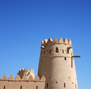 gray concrete castle under blue sky during daytime
