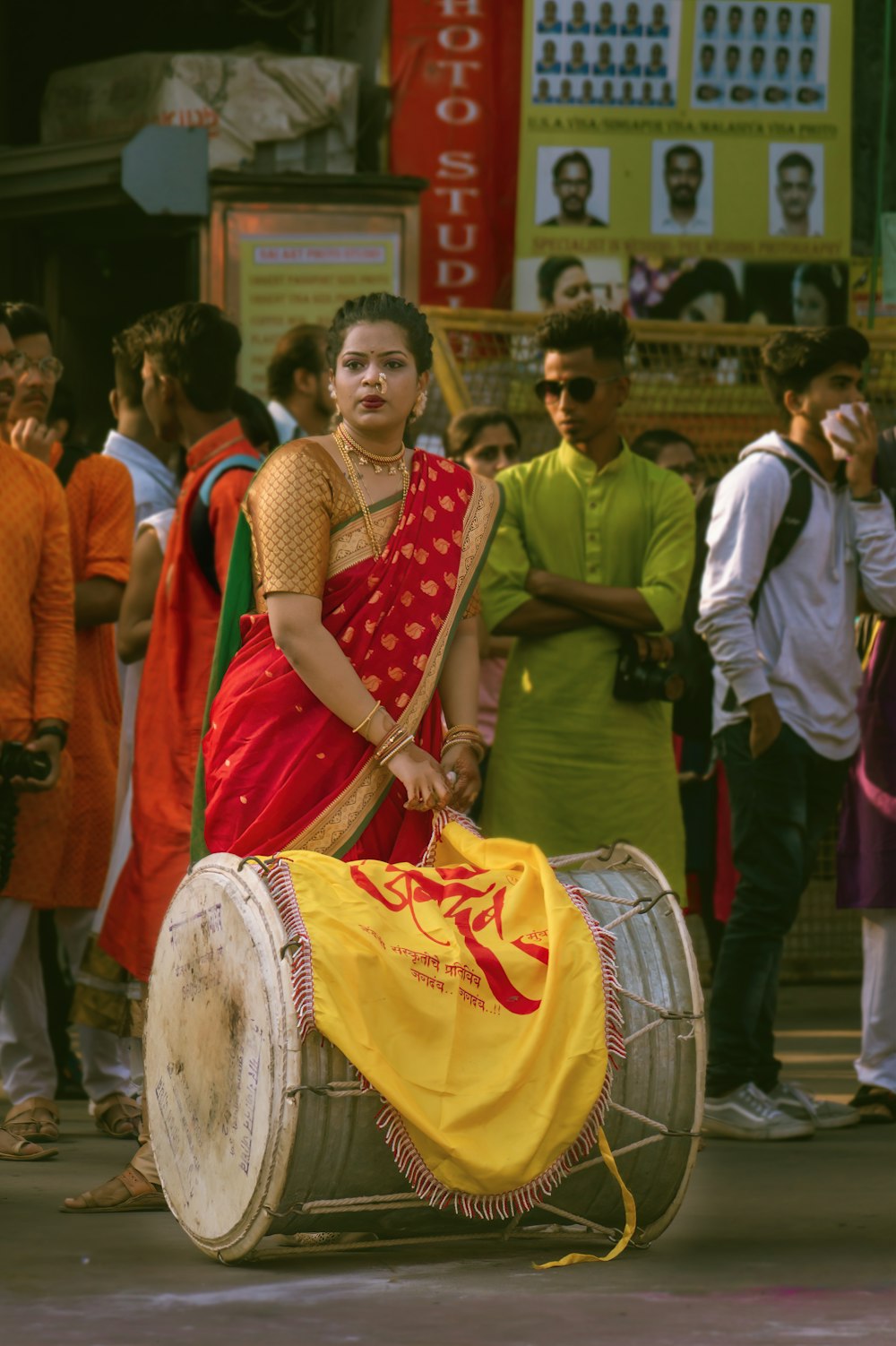 woman in red and white dress standing on street