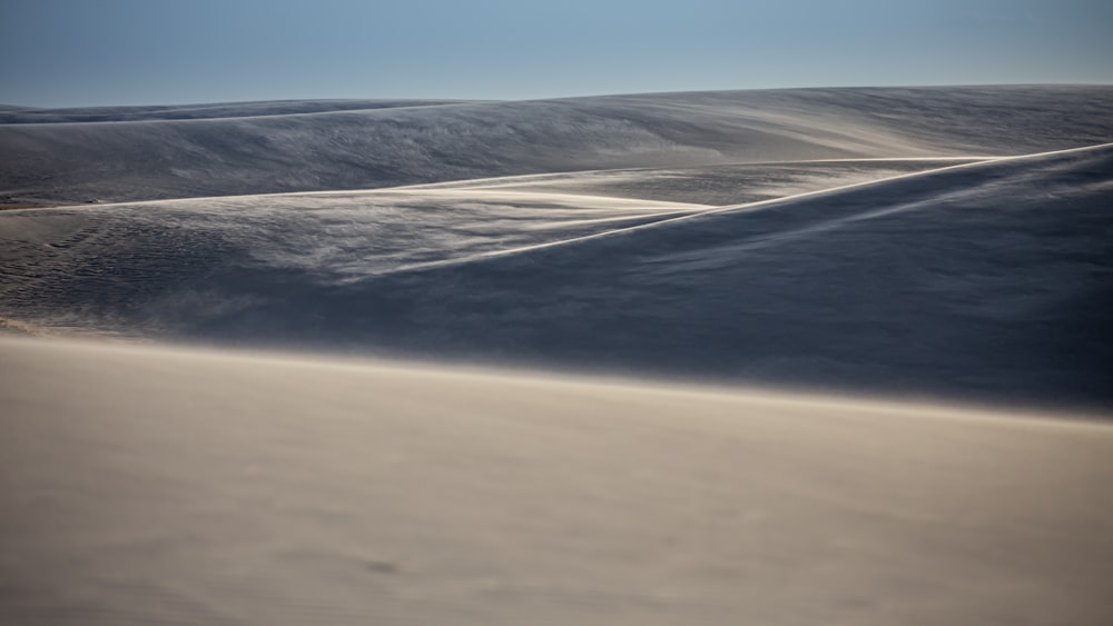 white sand under blue sky during daytime