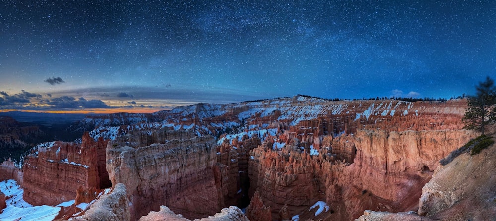 brown rocky mountain under blue sky during night time