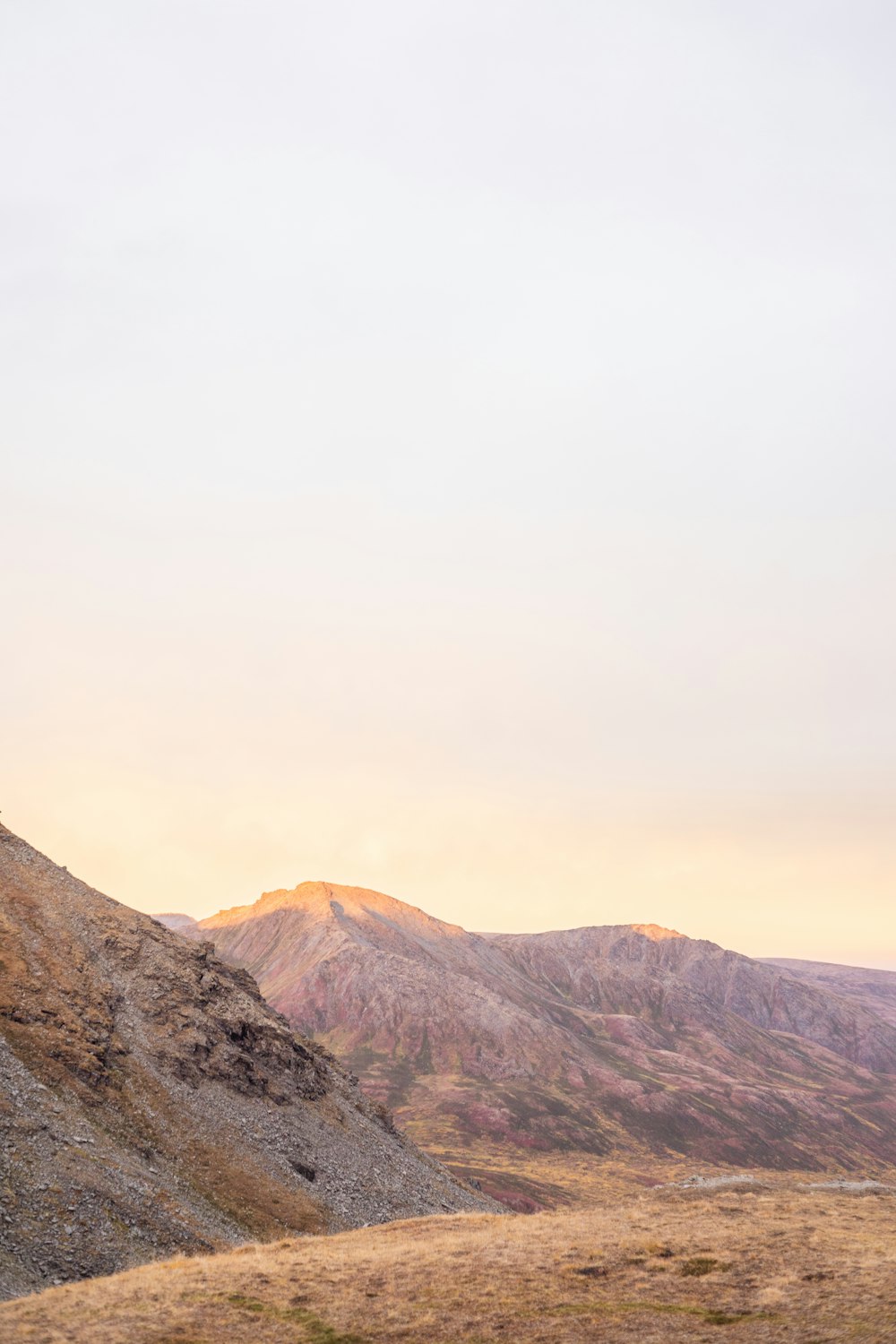 brown and gray mountains under white sky during daytime