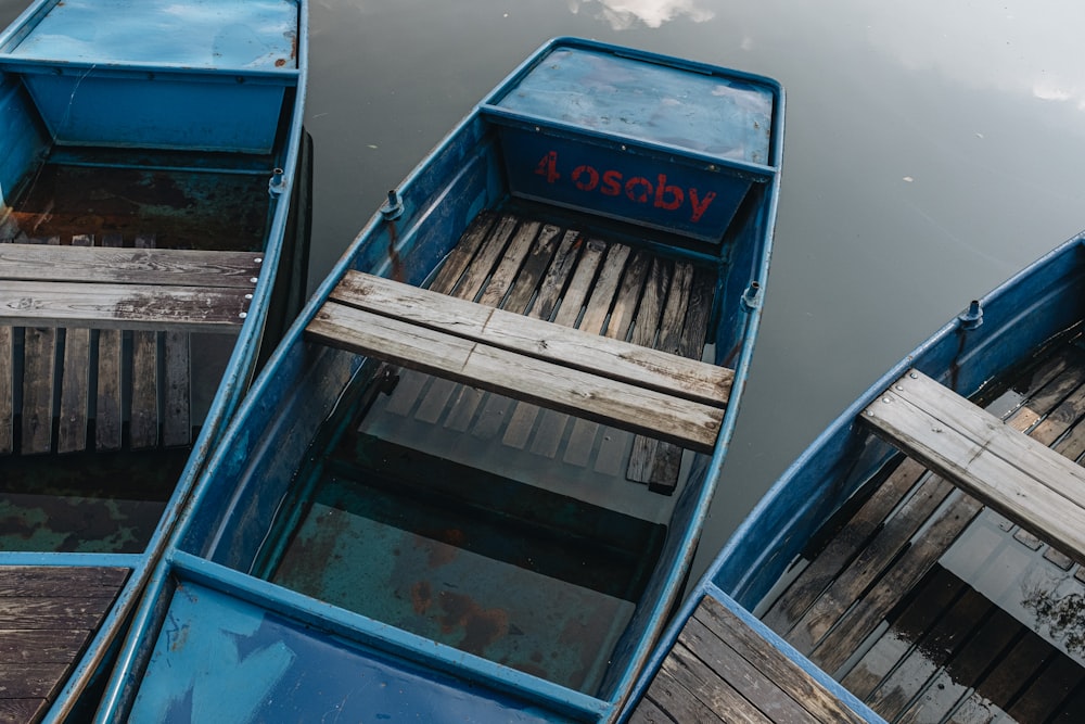 blue and white boat on water