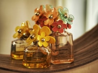 selective focus photography of 50 ml perfume bottle
