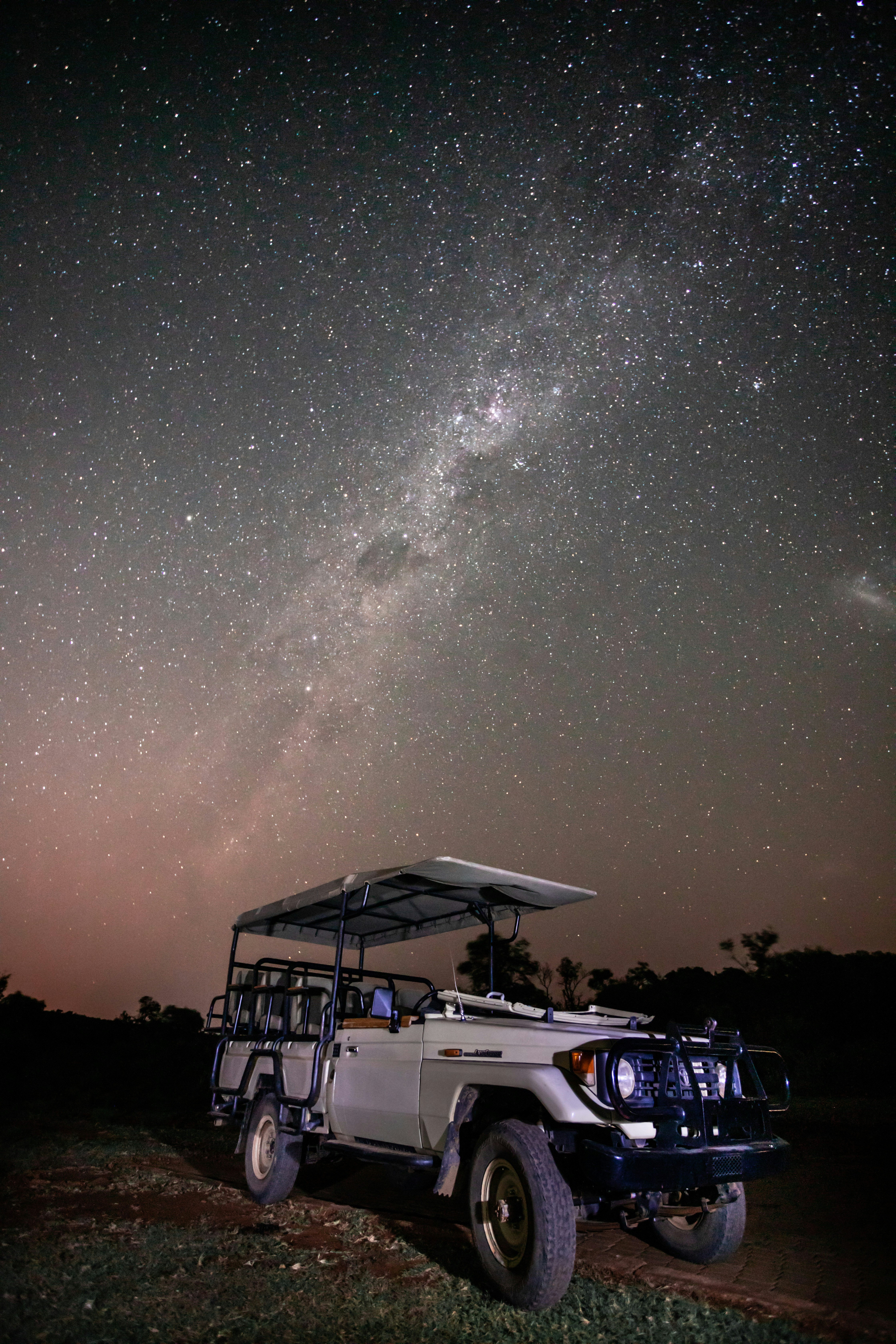 white suv on road during night time