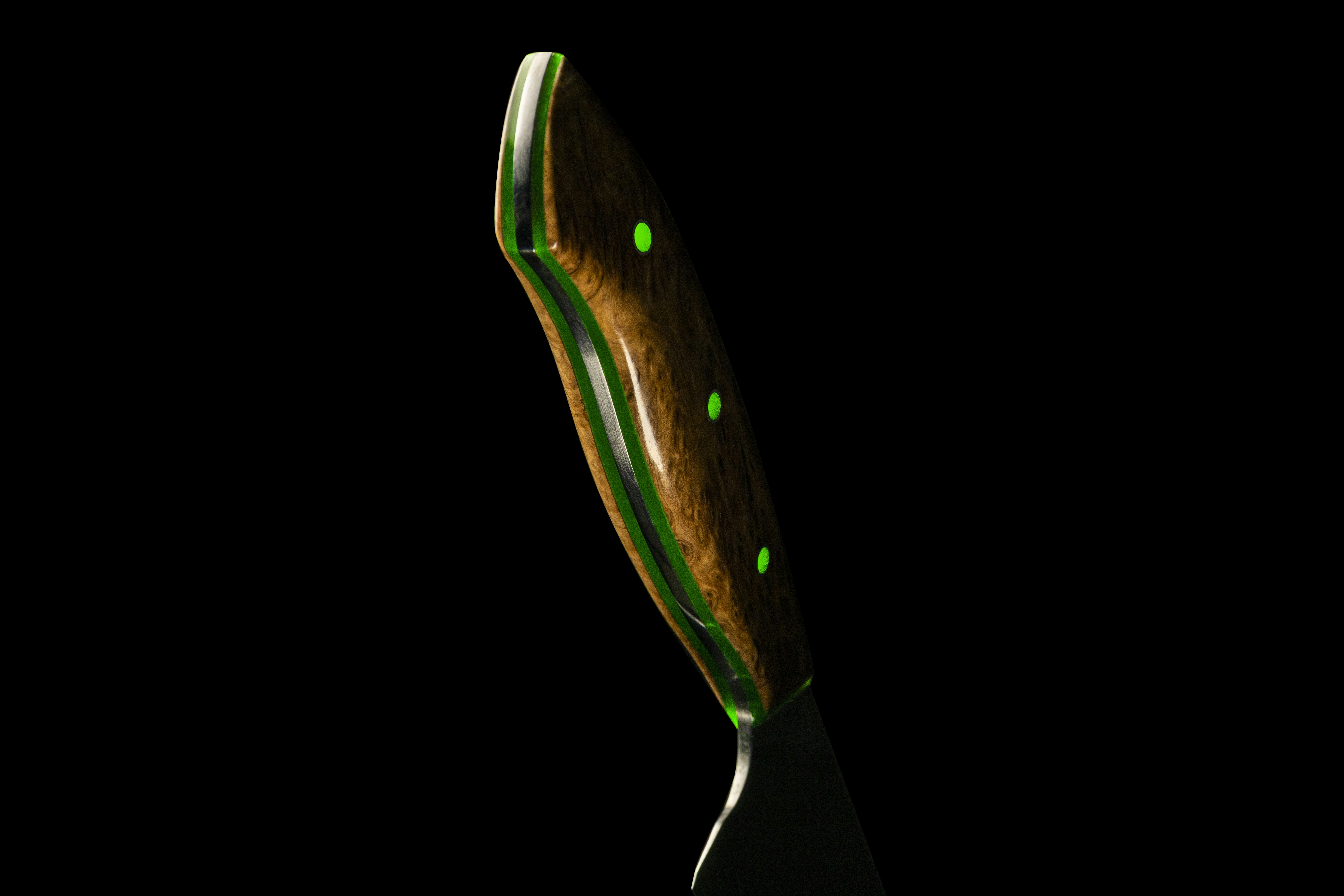 green and silver fork with white background