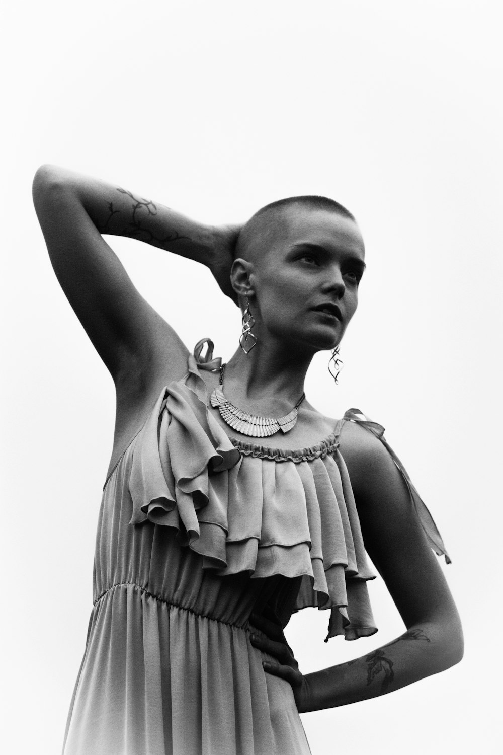 woman in dress statue grayscale photo