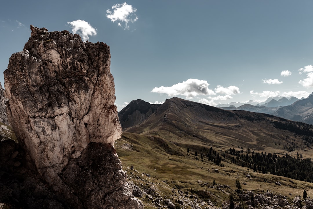 brown rocky mountain under blue sky during daytime