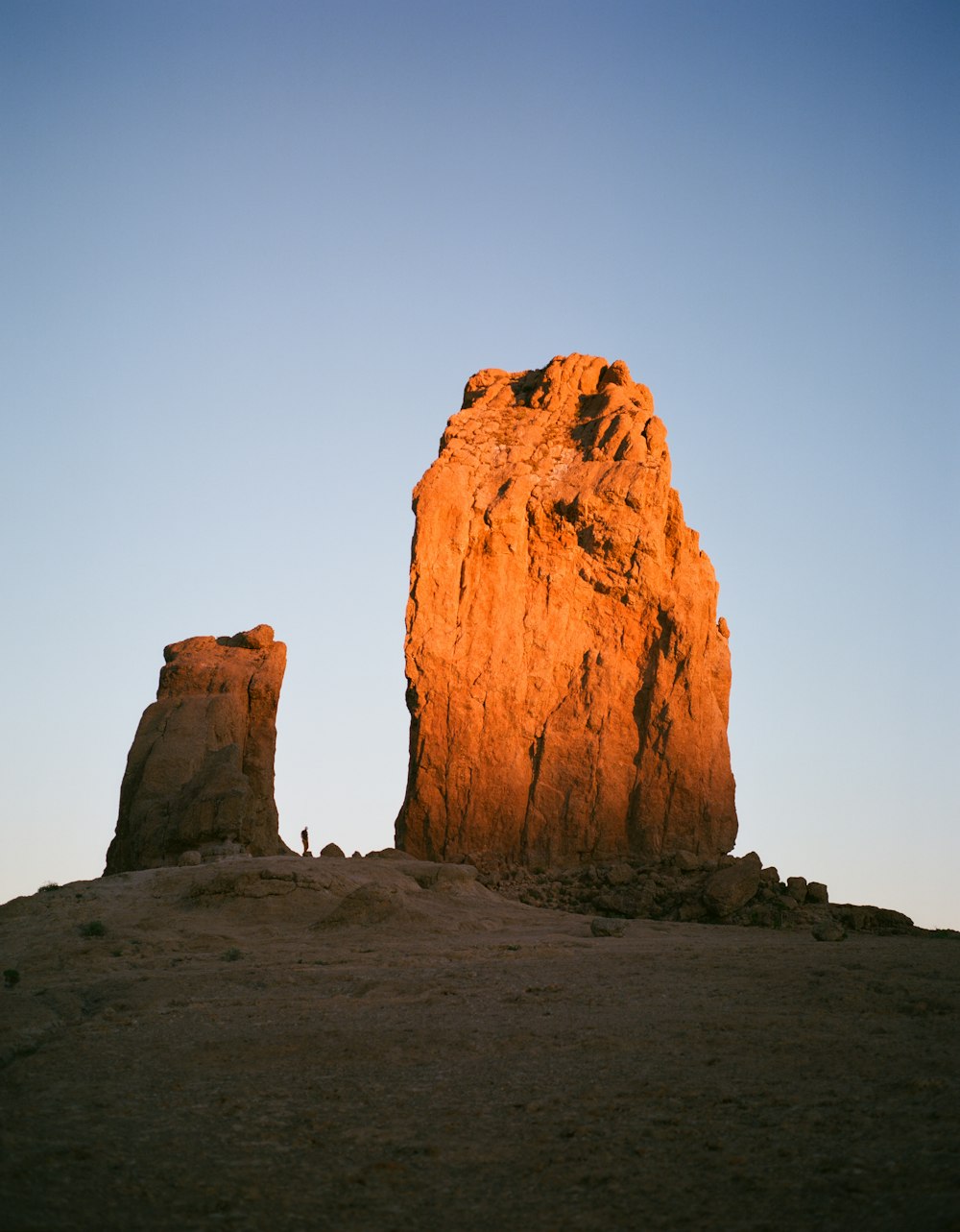 brown rock formation under white sky during daytime