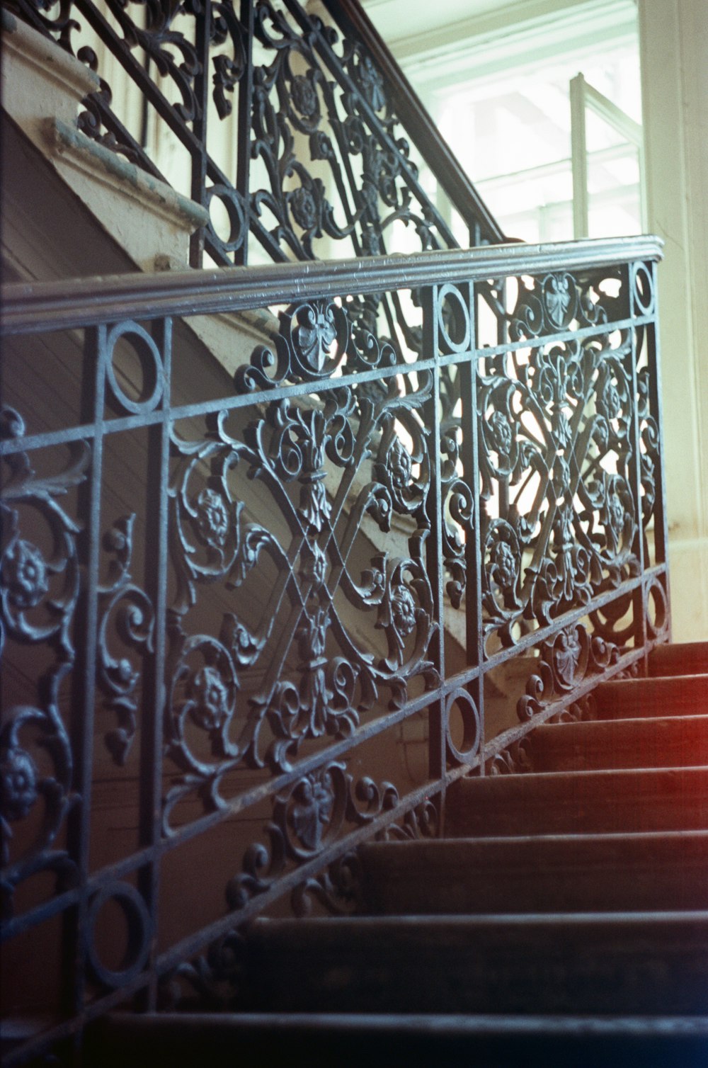 red and brown wooden staircase