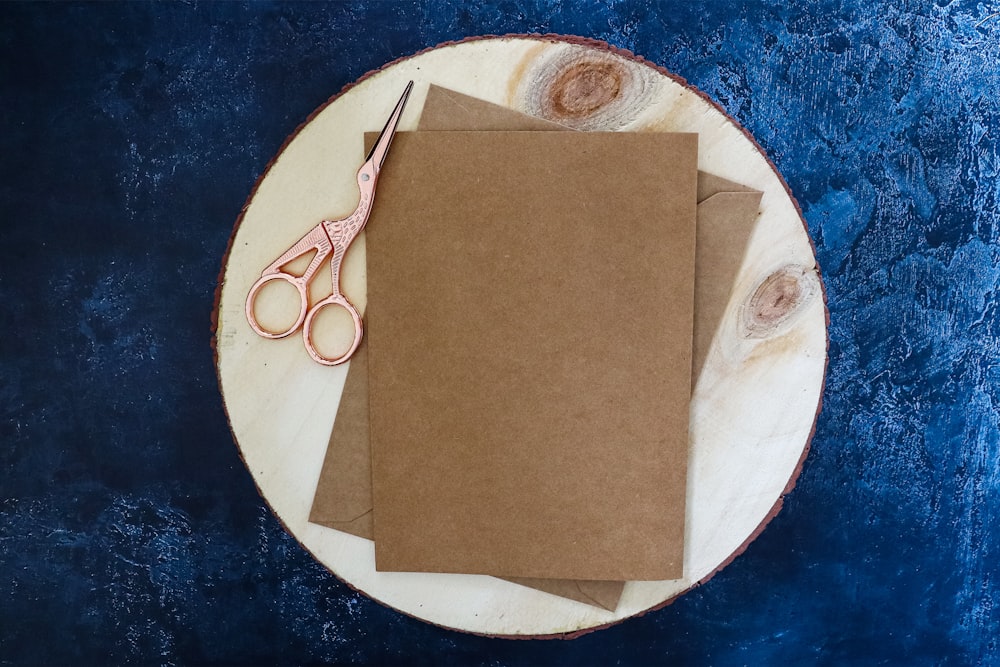 brown paper on white and blue round plate