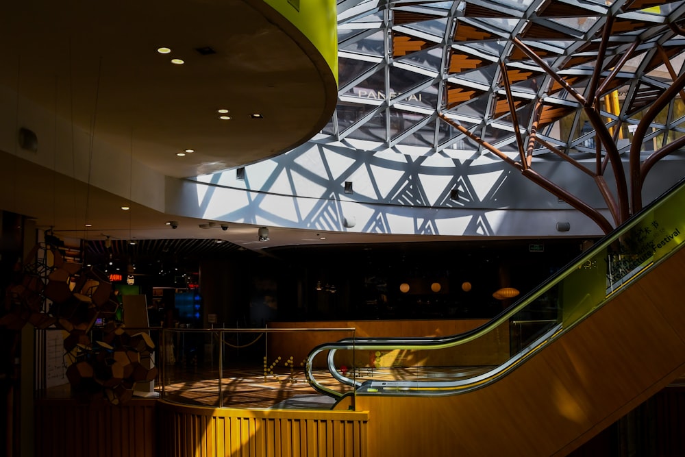 yellow and black escalator inside building