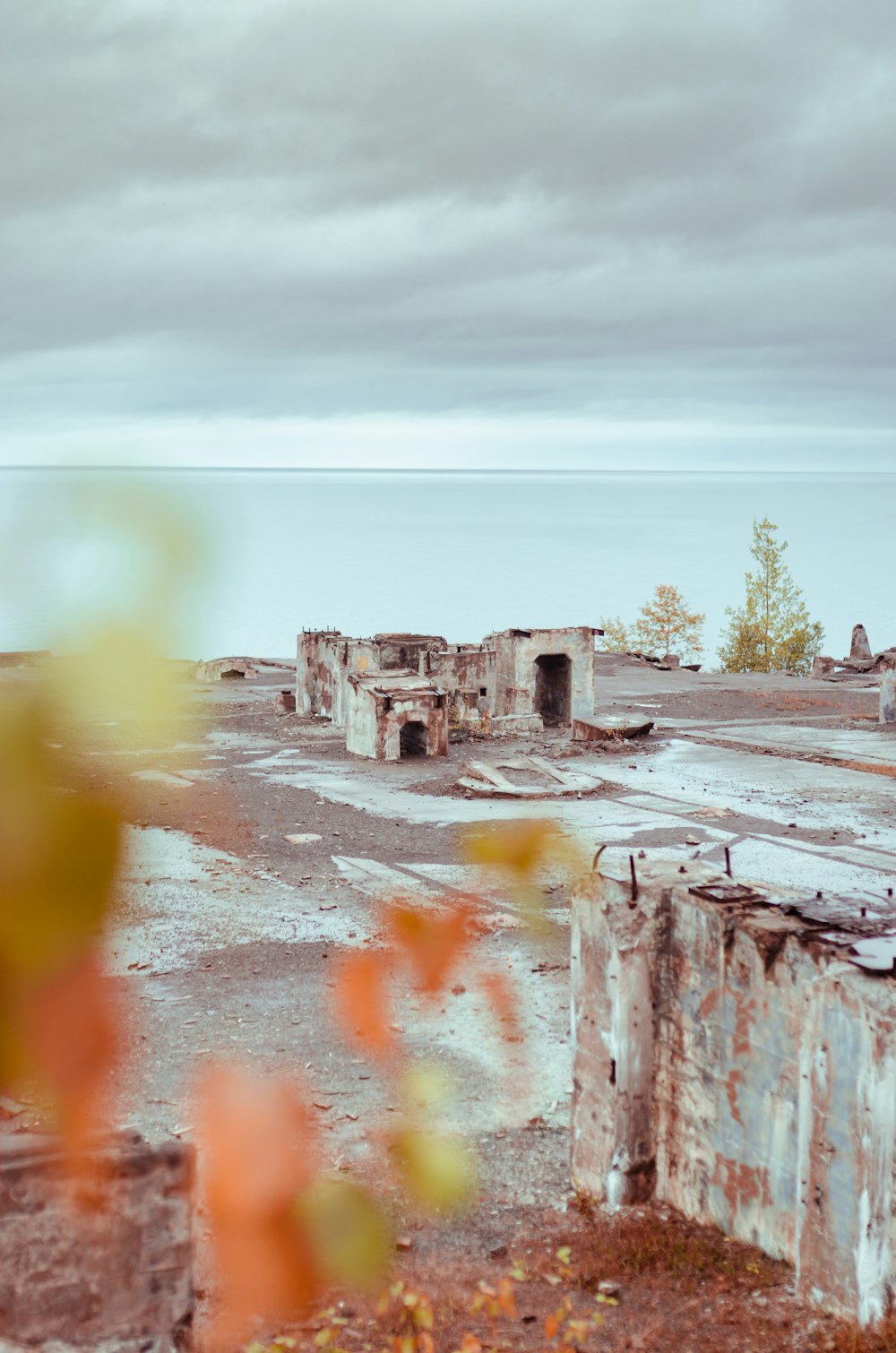 brown and gray concrete building near body of water during daytime