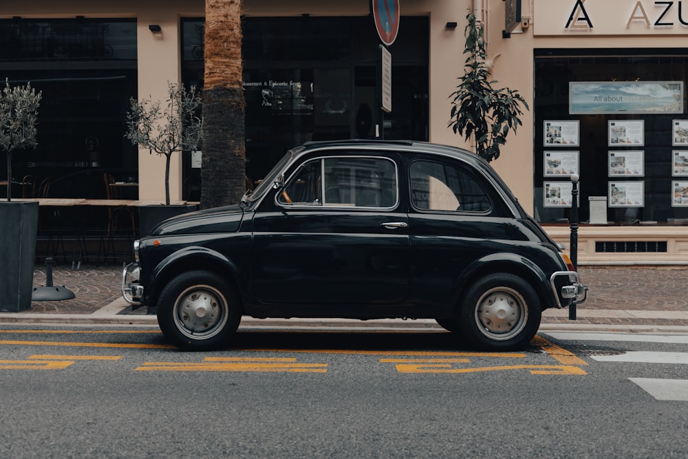 black station wagon parked on the side of the road