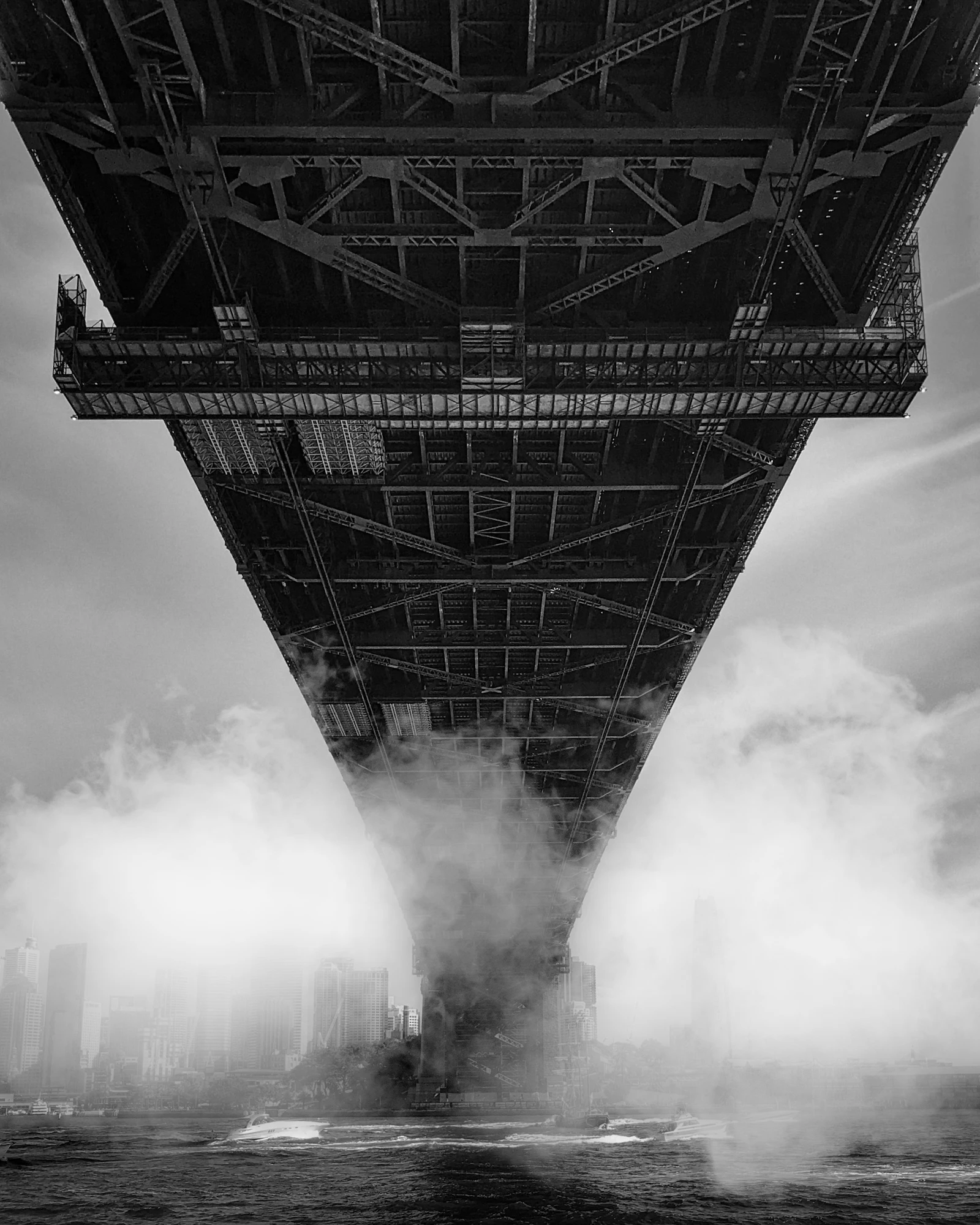 Black and white photo of the Sydney Harbour Bridge in mist