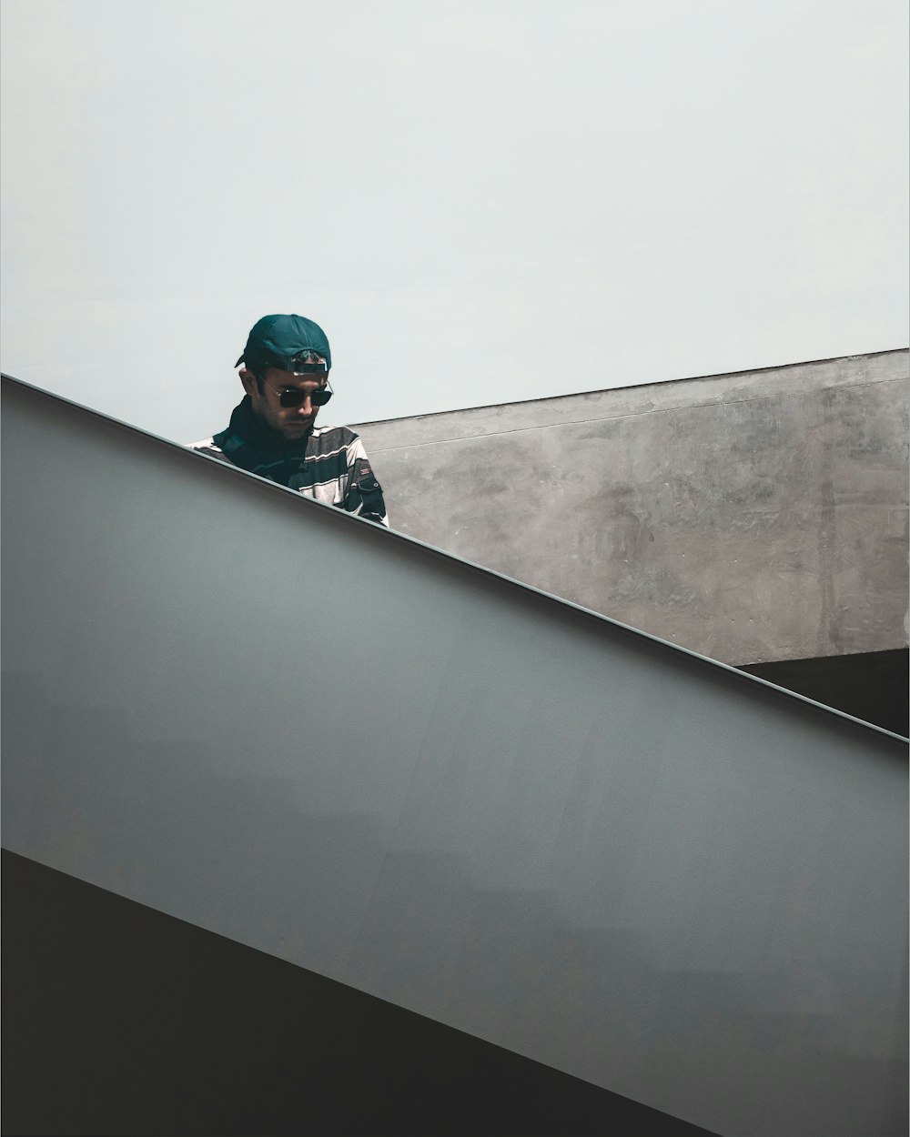 man in black jacket wearing blue helmet