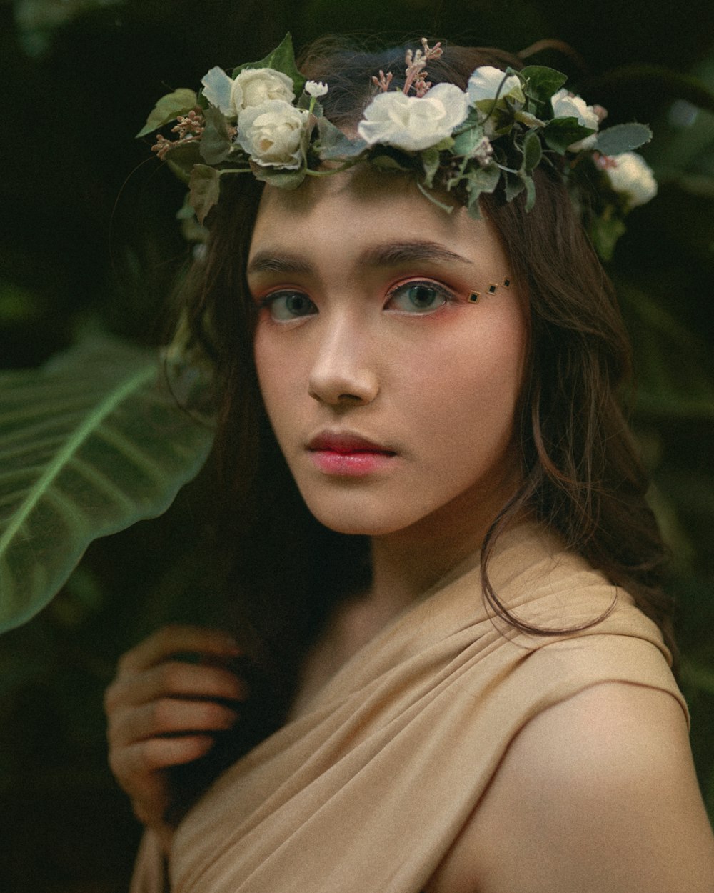 woman in white floral headband