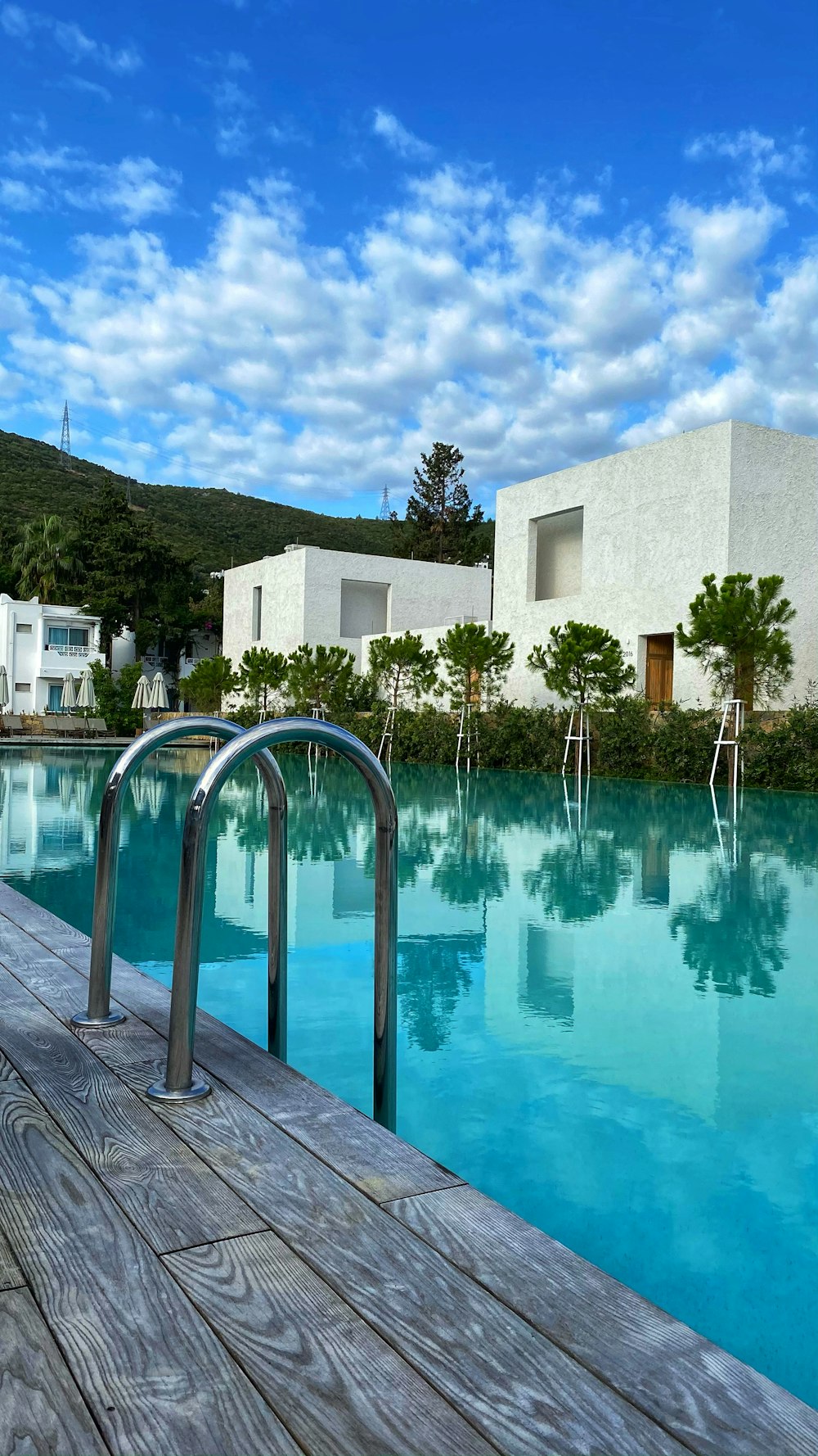 white concrete building near swimming pool during daytime