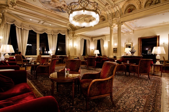 An elegantly arranged room with soft lighting and luxurious fabrics, creating an inviting atmosphere for intimate experiences.