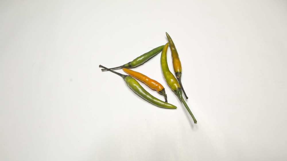 green chili on white table