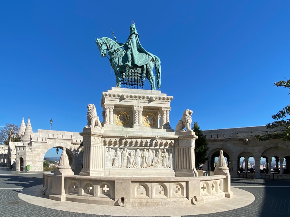 a statue of a man on a horse in a courtyard