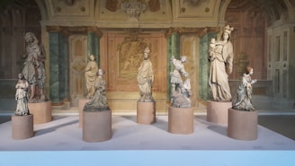 A beautifully arranged display of marble statues and gemstone art.