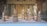 A beautifully arranged display of intricate wooden and marble statues on a velvet backdrop.