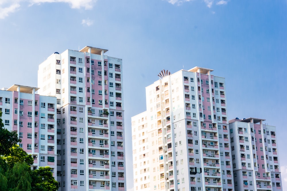 white concrete high rise building under blue sky during daytime