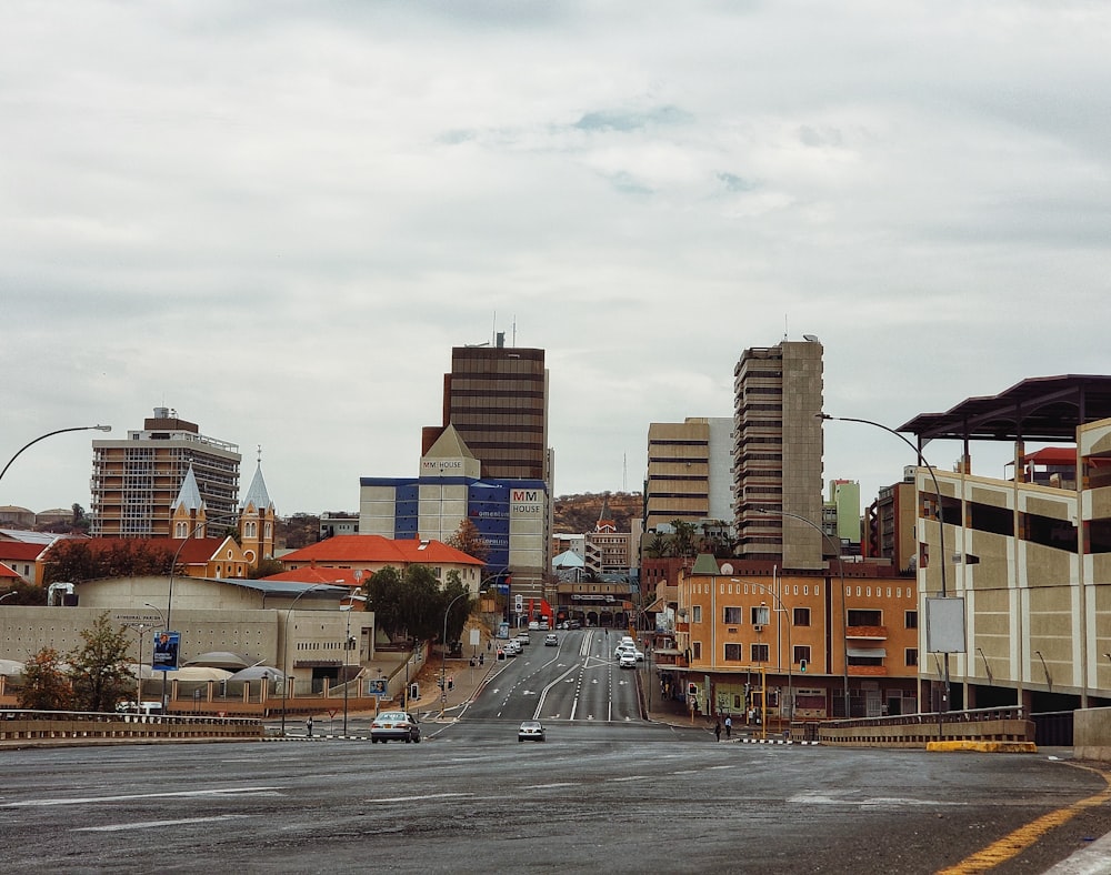 cars on road near buildings during daytime