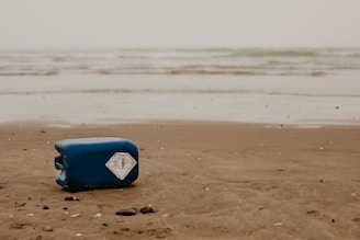 blue and white surfboard on beach during daytime