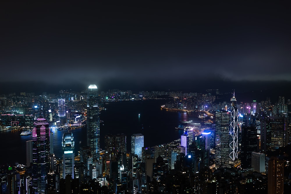 city with high rise buildings during night time