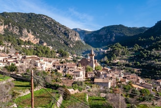 The town of Valldemossa in Mallorca with old stone houses surrounded by mountains
