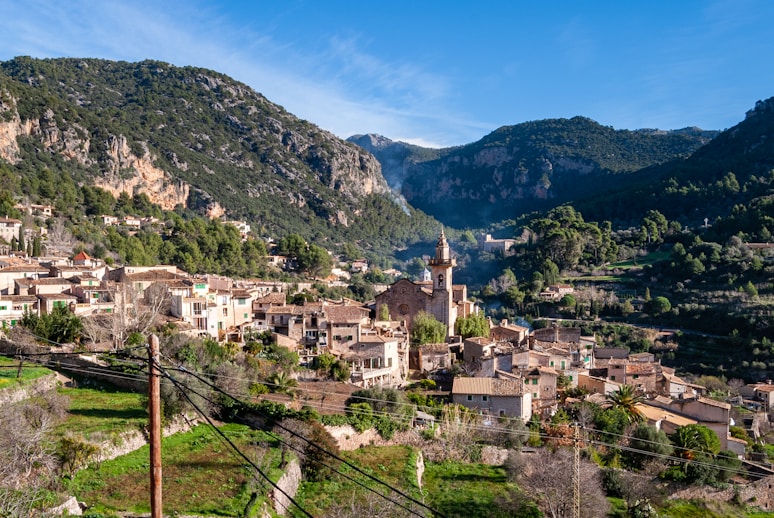 The town of Valldemossa in Mallorca with old stone houses surrounded by mountains