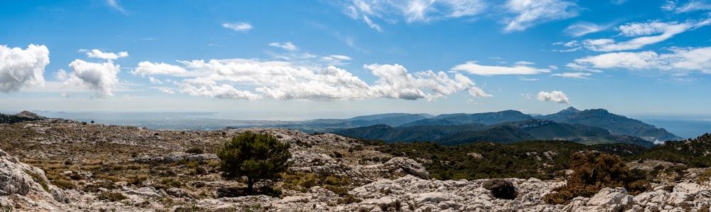 brown and green mountains under blue sky during daytime