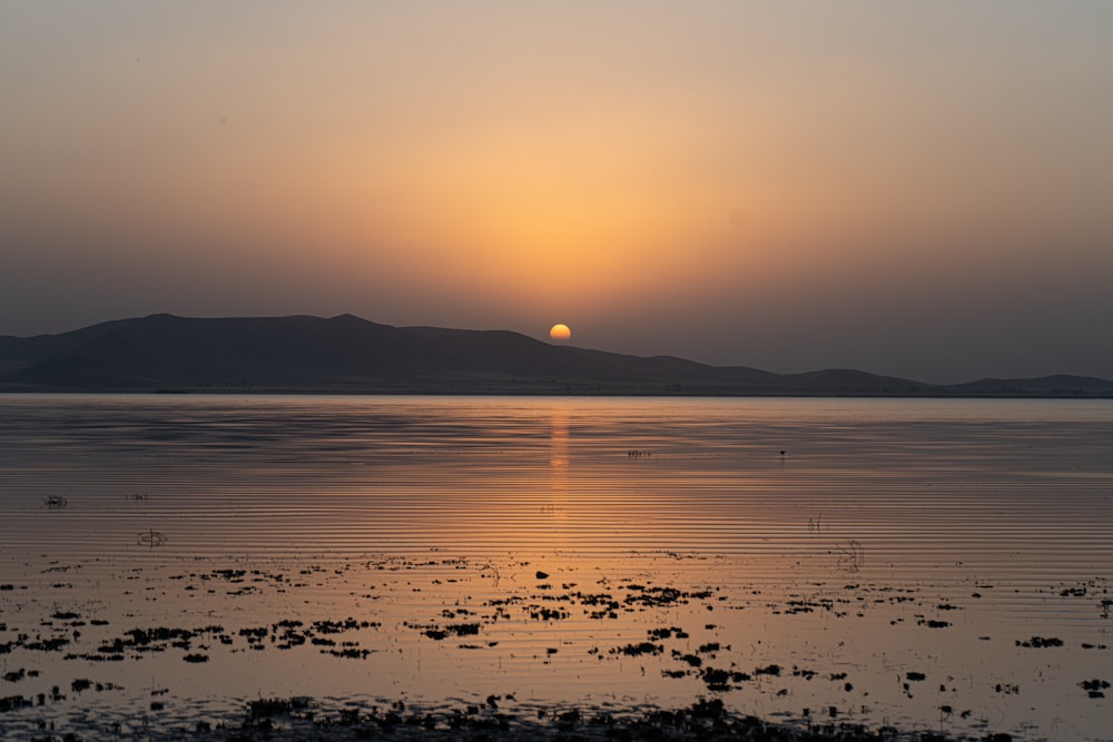 silhouette of mountains during sunset