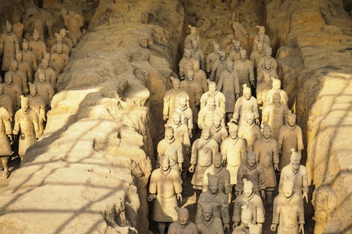 The ancient Terracotta Warriors standing in formation under soft daylight.