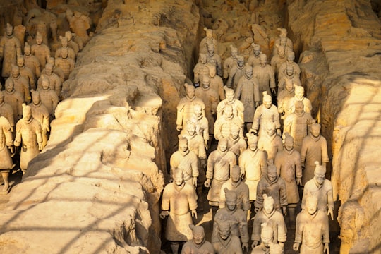 brown stone wall with human face carved in Xi’an China