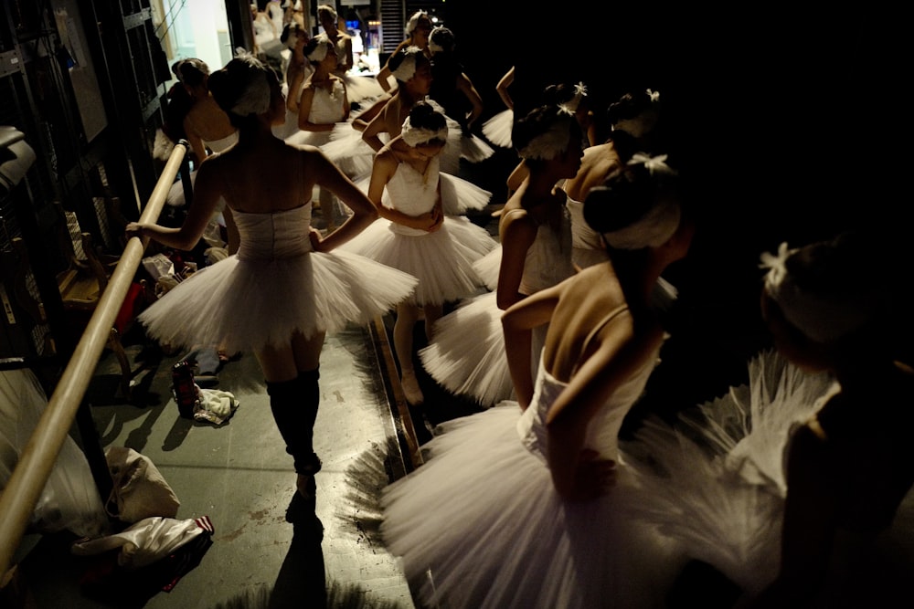 woman in white dress dancing on the floor