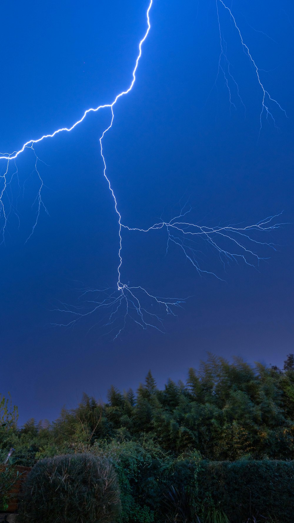 white lightning on blue sky