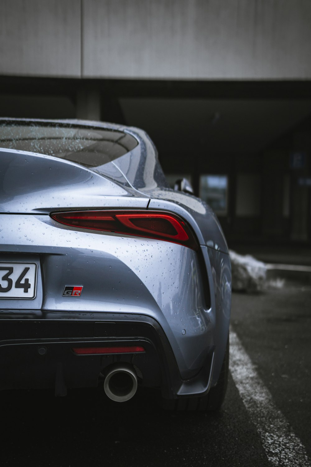 gray porsche 911 parked on road during daytime