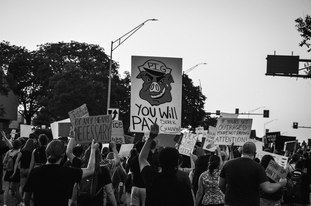 grayscale photo of people walking on street