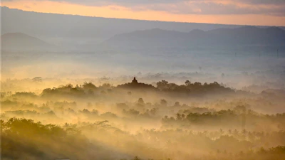 A serene sunrise over a peaceful temple nestled among lush greenery, inviting calm and reflection.