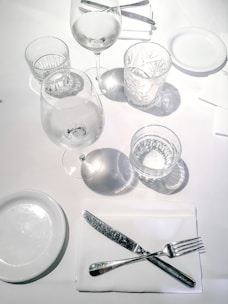 clear wine glasses on white table