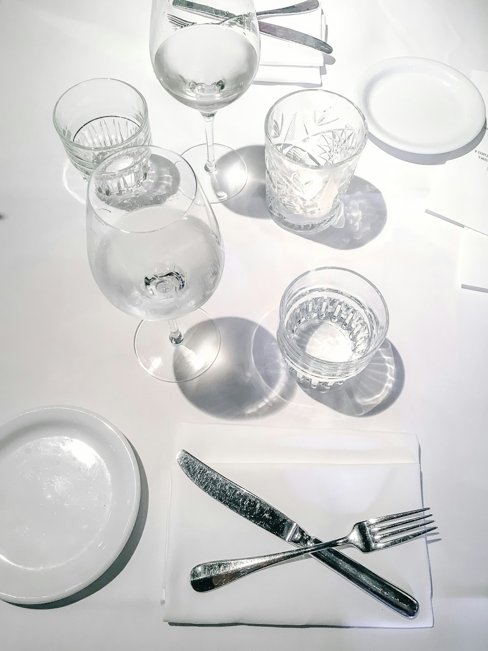 clear wine glasses on white table