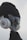 A creative visual of a guitar headstock dressed up with a hat, sunglasses, and headphones, giving it a human-like appearance.