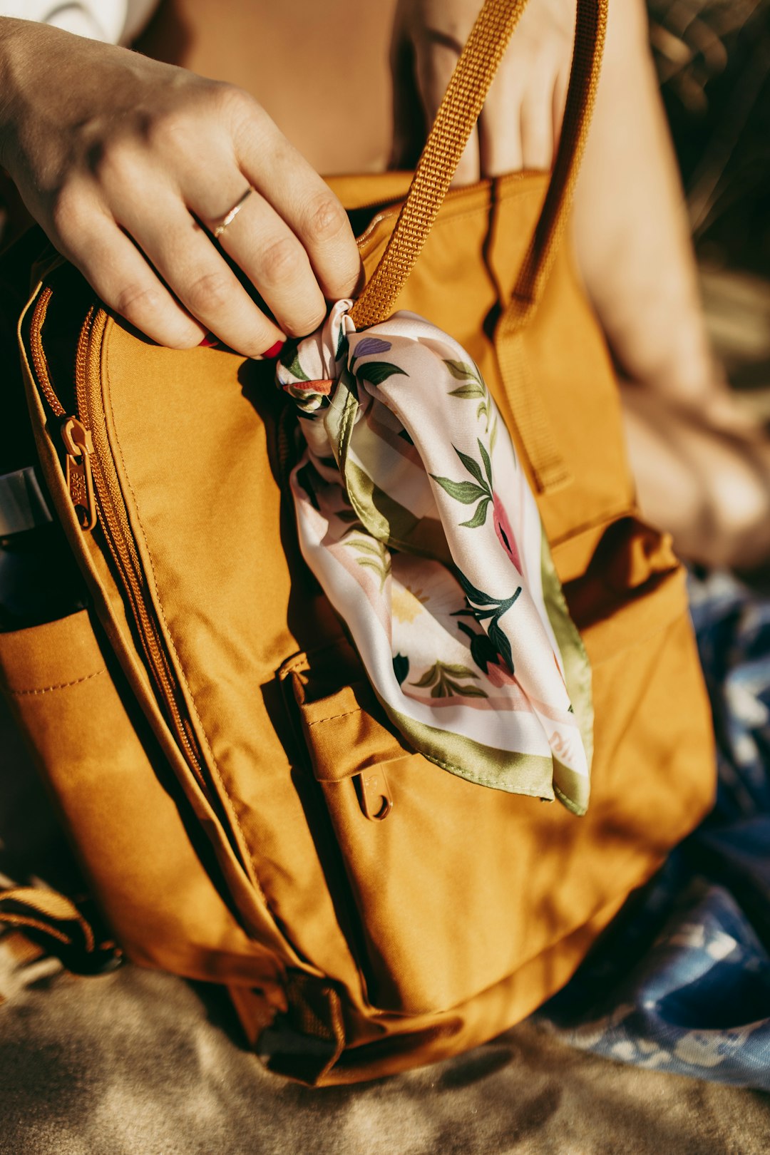 person holding brown leather bag