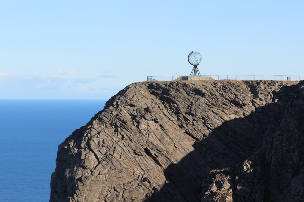 white and black basketball hoop on brown rock formation during daytime