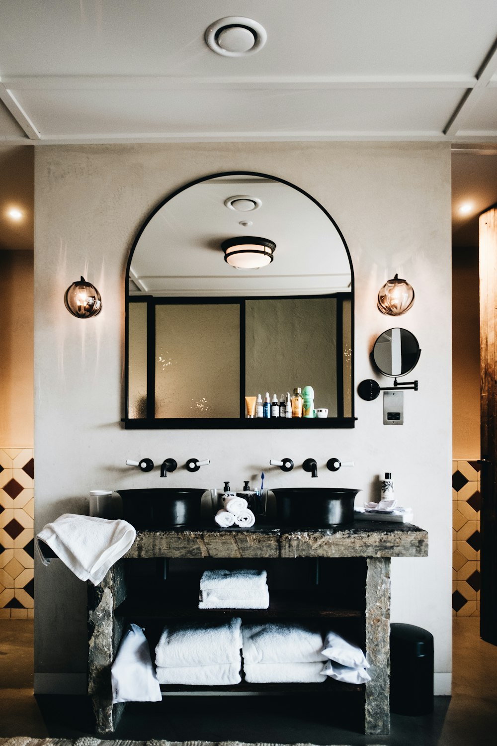 white towel on black and white marble sink