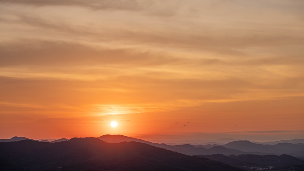 silhouette of mountains during sunset