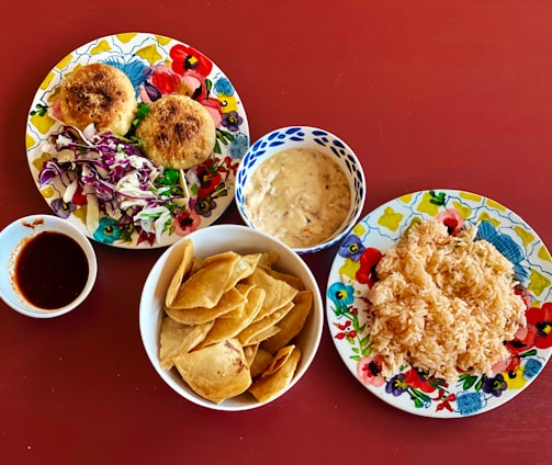 fried food on white and red ceramic plate