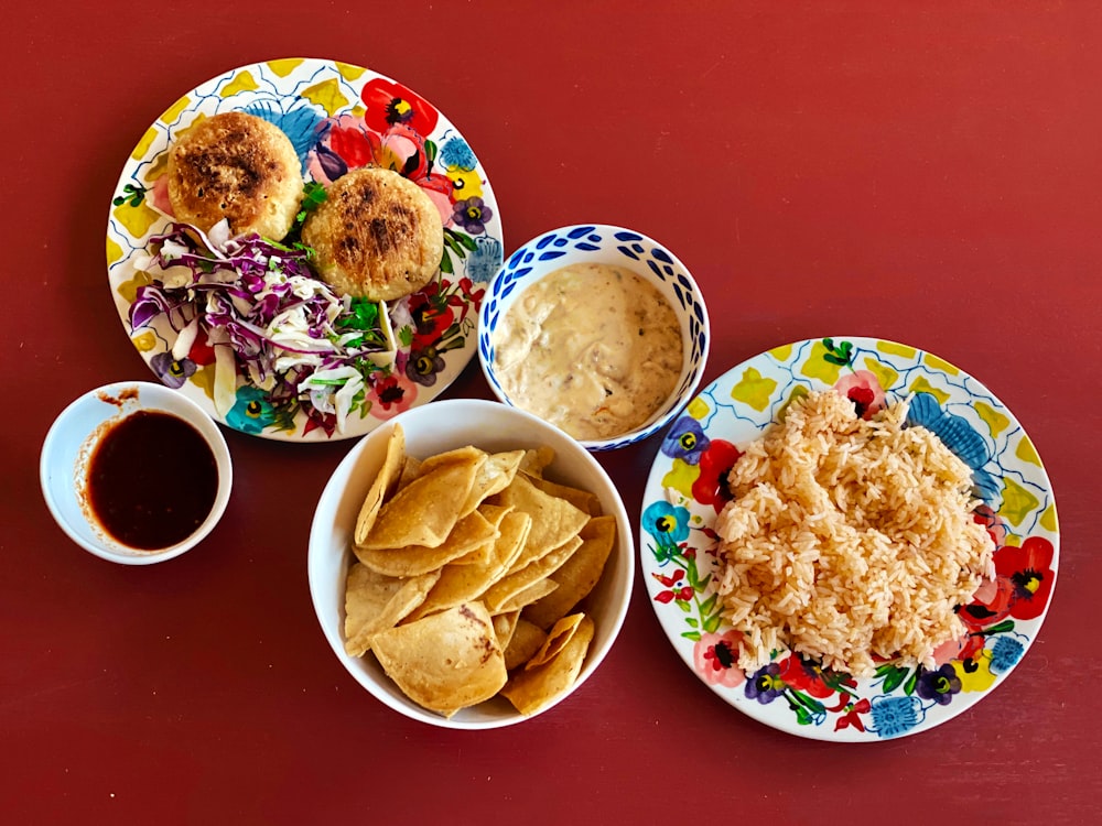 fried food on white and red ceramic plate